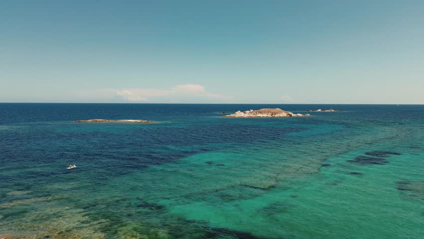 Aerial View of Aegean Sea with clear water seascape. View from drone shot of exotic water from Greece. Travelling concept.