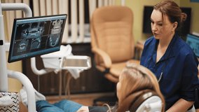 Oral surgery and stomatology, doctor and patient looking x-rays on display. Consultation with professional dentist and surgeon, dental treatment and implantation, medical appointment in dental clinic - Powered by Shutterstock - Get 15% off with code: PIKWIZARD15