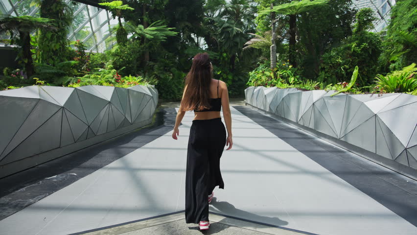 Woman walking inside Flower Dome Singapore Gardens by the Bay
