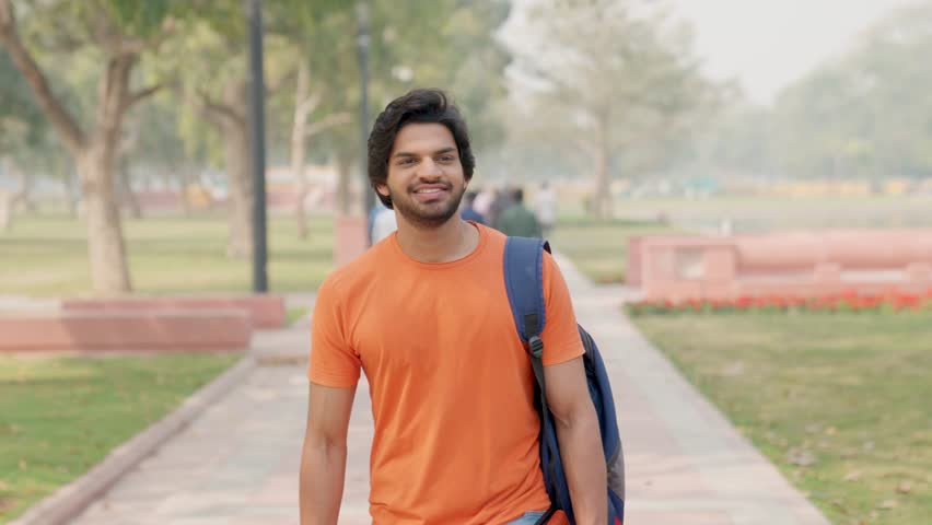 Happy Indian Male College Student Walking