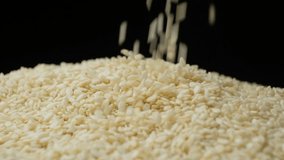White Sesame Seeds Pour Slow Motion Close-Up - Powered by Shutterstock - Get 15% off with code: PIKWIZARD15