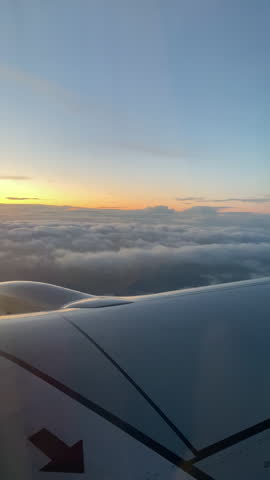 Cloudy horizon over the wing of a plane