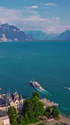 Geneva is a city in Switzerland, located at the southwestern end of the vast Lake Leman. A drone flies over the sheep