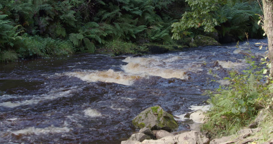 Wide shot river hepste at Sgwd Yr Eira waterfall
