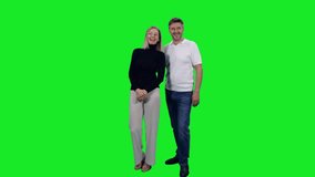 Happy adult man and stylish woman looking at something and discuss on green chroma key background, 4k pre-keyed footage - Powered by Shutterstock - Get 15% off with code: PIKWIZARD15