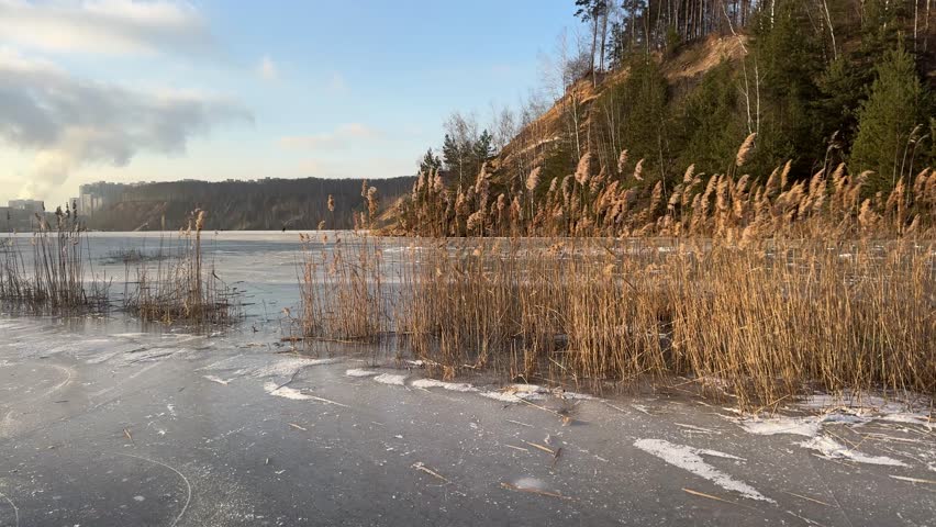 Frozen surface of a reservoir in winter. Ice.