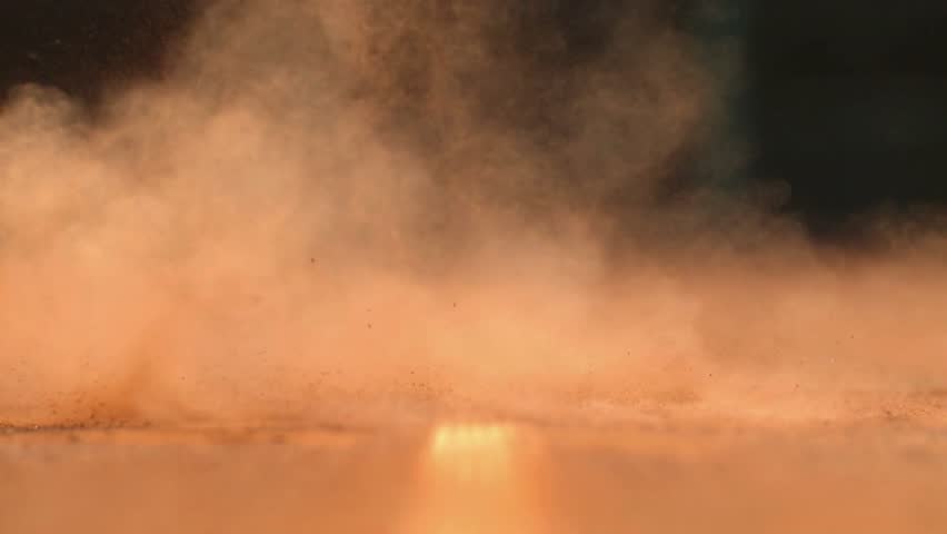 Close-up of a tennis ball hitting the ground.