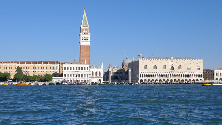View from water taxi over Venetian Lagoon in front of Riva degli Schiavoni and Doge