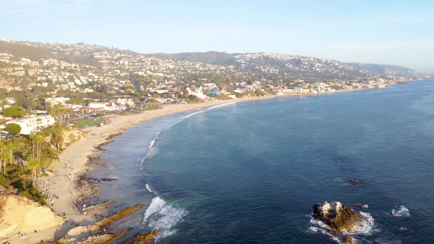 Laguna Beach, Waterfront Coastal Trail Park, Monument Point. SoCal Sunset, Orange County Coastal Shore, Southern California, USA. Palm Trees on Cliffs. Walking Path. Heisler Park, Pacific Ocean Waves