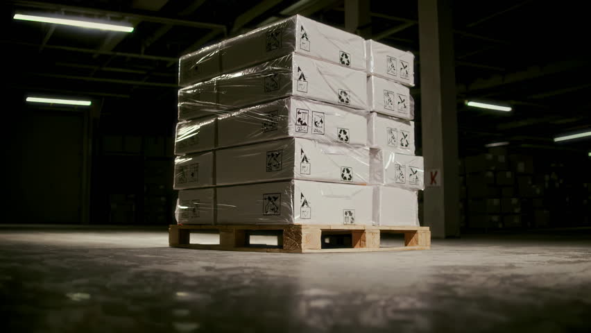 A meticulously organized and arranged pallet of various types of boxes sitting in a spacious, welllit warehouse. 3D Illustration