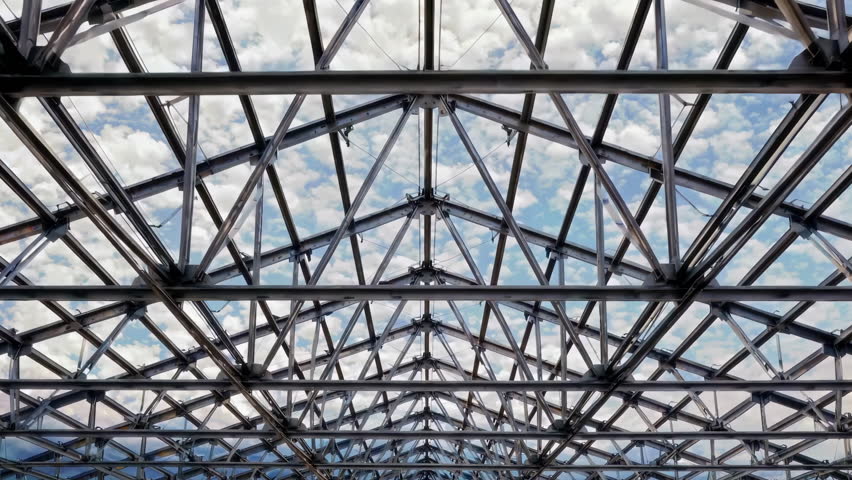 An intricate and exquisite design of a glass roof beautifully showcasing a steel framework against a cloudy sky. 3D Illustration