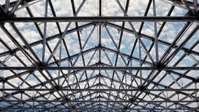 An intricate and exquisite design of a glass roof beautifully showcasing a steel framework against a cloudy sky. 3D Illustration - Powered by Shutterstock - Get 15% off with code: PIKWIZARD15