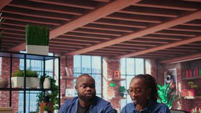 Black man and woman sits together in their cozy apartment space, discussing digital marketing strategy on a laptop. Supporting each other in their remote work and freelancing journey. Camera A. - Powered by Shutterstock - Get 15% off with code: PIKWIZARD15