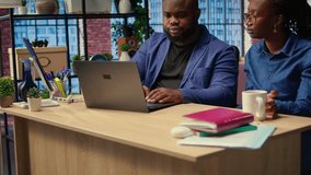 Woman completing spreadsheets on notebook, entering numerical data into cells, calculating totals. African american couple analyzing online information for an accounting task. Camera A. - Powered by Shutterstock - Get 15% off with code: PIKWIZARD15