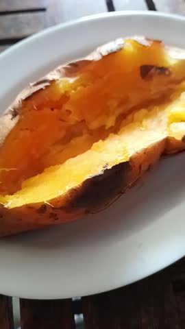smoke coming out of a roasted sweet potato 