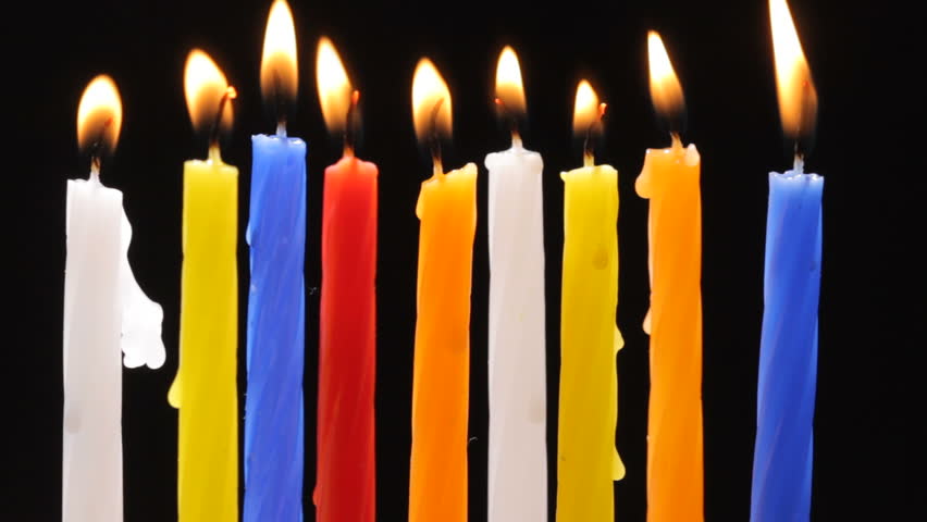 Time lapse HD video of colorful burning candles