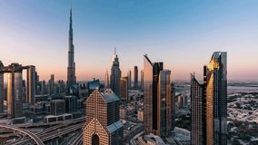 This stunning aerial drone footage showcases a breathtaking view of Dubai’s skyline, featuring the iconic Burj Khalifa towering above the city. The video captures an intricate road junction, modern sk - Powered by Shutterstock - Get 15% off with code: PIKWIZARD15