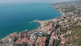 heartbreaking aerial shot of a beach with a skyscraper on the  green ocean beach , natural beauty and human development concept, finance and capital development, natural beauty with freedom and relaxe - Powered by Shutterstock - Get 15% off with code: PIKWIZARD15
