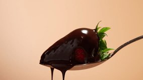 Spoon with strawberries on it, chocolate dripping. Spoon in the air, chocolate pouring onto strawberries. Strawberries covered in chocolate. - Powered by Shutterstock - Get 15% off with code: PIKWIZARD15