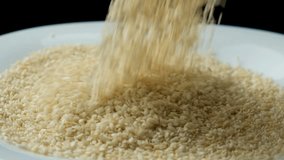 White Sesame Seeds Pour Slow Motion Close-Up - Powered by Shutterstock - Get 15% off with code: PIKWIZARD15