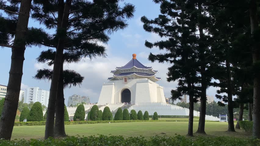 Distant View of Chiang Kai-shek Memorial Hall, a famous historical landmark in Taipei, Taiwan, built to honor former President Chiang Kai-shek and featuring traditional Chinese architecture.