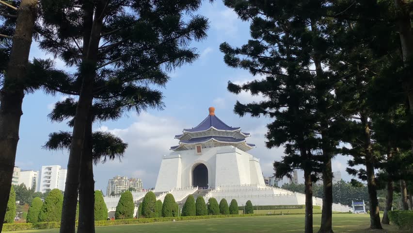 Distant View of Chiang Kai-shek Memorial Hall, a famous historical landmark in Taipei, Taiwan, built to honor former President Chiang Kai-shek and featuring traditional Chinese architecture.