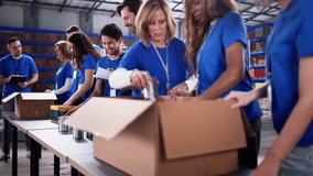 Food Bank Volunteer Community Packing Donation. Non Profit Aid And Support - Powered by Shutterstock - Get 15% off with code: PIKWIZARD15