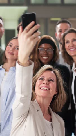 Diverse Group Of People Taking Selfie At Work Event. Business Team