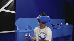 Guy in a virtual reality club wearing virtual reality glasses - Powered by Shutterstock - Get 15% off with code: PIKWIZARD15