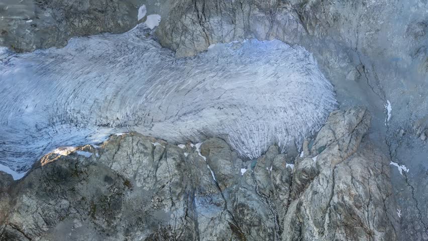 Stunning aerial view of a melting glacier, highlighting the impact of climate change and global warming on the environment. British Columbia, Canada.