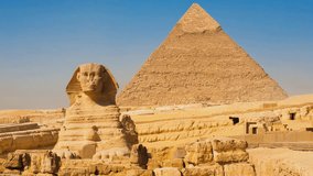 A stunning aerial view of the Great Sphinx and the Pyramid of Giza two of the most iconic landmarks of ancient Egypt.  - Powered by Shutterstock - Get 15% off with code: PIKWIZARD15