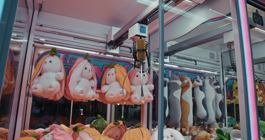 Claw machine filled with colorful plush toys, showcasing playful and vibrant characters