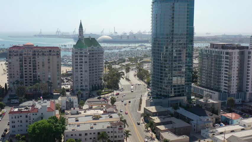 Downtown Long Beach, California: A Vibrant Urban Panorama of Skyscrapers, Historic Buildings, and Waterfront Views with Queen Mary and Spruce Goose Dome Highlights