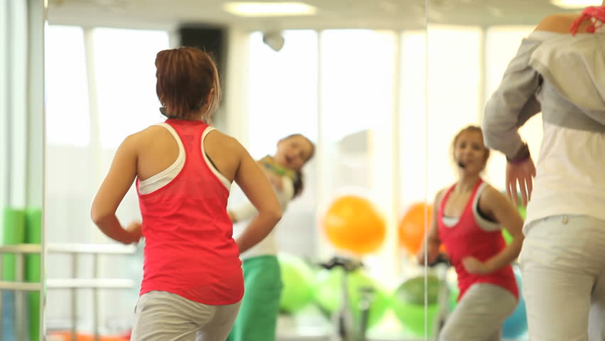 Back energy women doing exercises while aerobics
