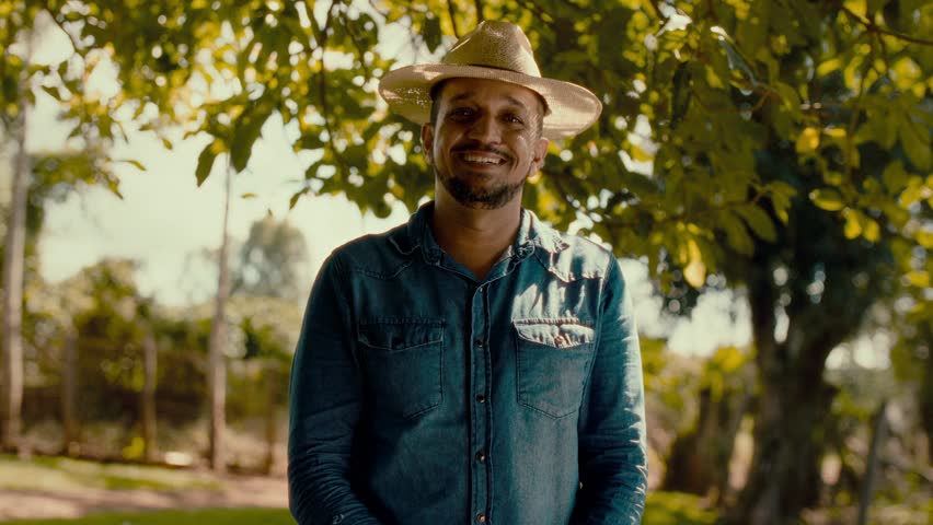 Young Brazilian Farmer Smiling Confidently with Arms Crossed – Premium Cinematic 4K