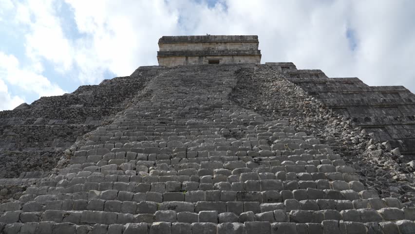 Detailed view of the worn stone staircase of El Castillo pyramid at Chichen Itza, Mexico.