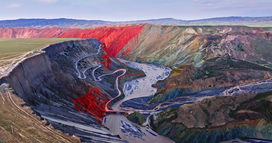Aerial view of spectacular canyon and river natural landscape at dusk. Beautiful Anjihai Grand Canyon geological scenery in Xinjiang, China.