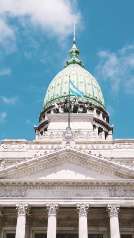 Green dome, Argentine flag waves over national Congress at Buenos Aires city Sky Government building, Vertical view