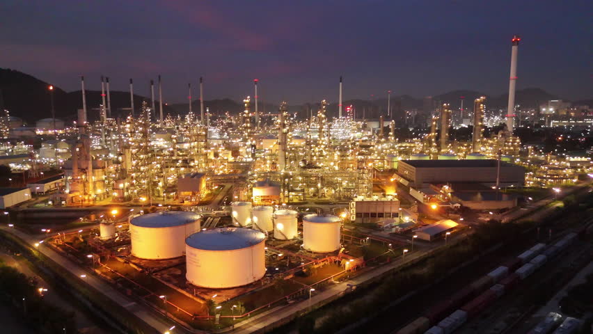 Oil Refinery plant at sunset. Gas Chemical Equipment Prodiction import export Concept, Crude Oil Refinery Plant Steel Pump Pipe line and Chimney and Cooling tower, Chemical Petrochemical