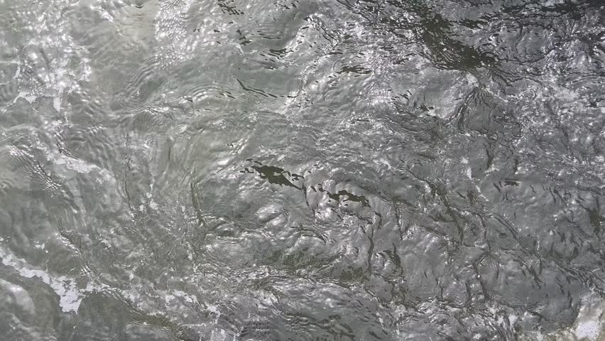 The rapid flow of river water towards the salt ponds. irrigation of salt ponds in Pamekasan, Indonesia