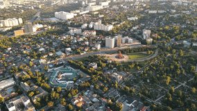 Aerial drone view of Memorial Complex Eternity in Chisinau at sunset. View of the city, prison, monument with eternal fire, greenery around. - Powered by Shutterstock - Get 15% off with code: PIKWIZARD15