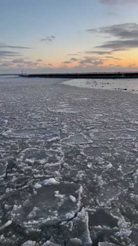 Beautiful sky after sunset over a frozen lake