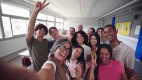 Cheerful selfie of young group of students waving and looking at camera with big smiles with their female teacher in the classroom, celebrating the back to school. - Powered by Shutterstock - Get 15% off with code: PIKWIZARD15