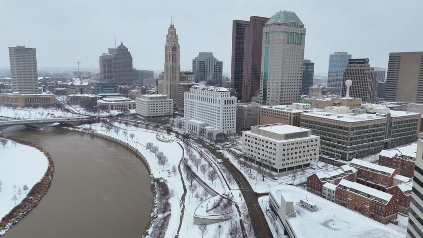 Columbus Ohio skyline in the winter with snow, aerial drone