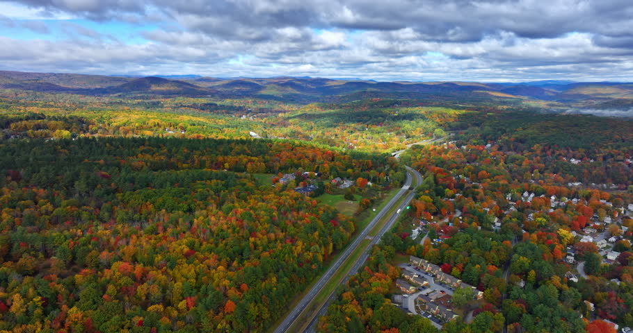Amazing scenery of Vermont, New England, USA in autumn. Two parallel highways cross the wooded landscape. Aerial perspective.