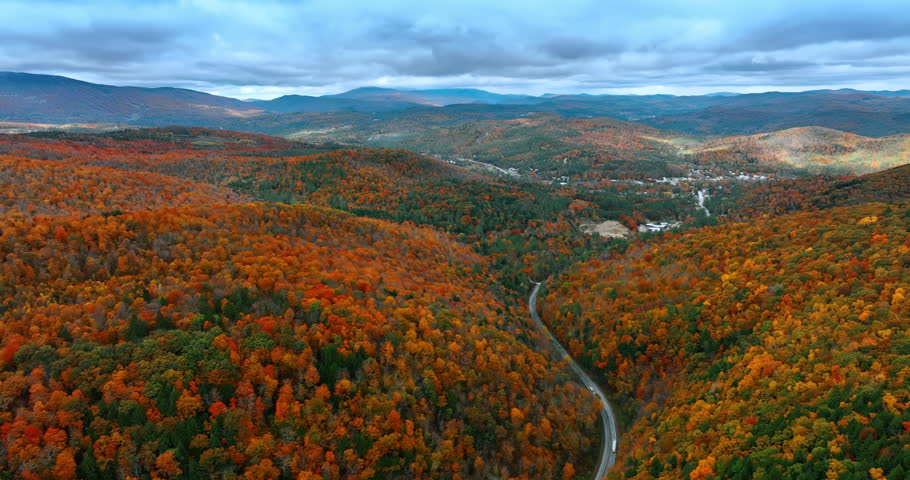 Vermont, New England, USA in autumn season. Lush colorful forests cover the mountains. Top view.