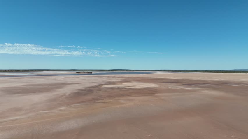 Lake Amadeus salty mud basin is the largest salt lake in Northern Territory Australia, about 50 km north of Uluru or Ayers Rock, stretching 180 kilometers long and 10 kilometers wide