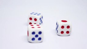 dice spinning and rotating on a clean surface. The dice have red and blue pips, creating a dynamic and engaging motion. Perfect for gaming, luck, chance, and casino-related content. - Powered by Shutterstock - Get 15% off with code: PIKWIZARD15