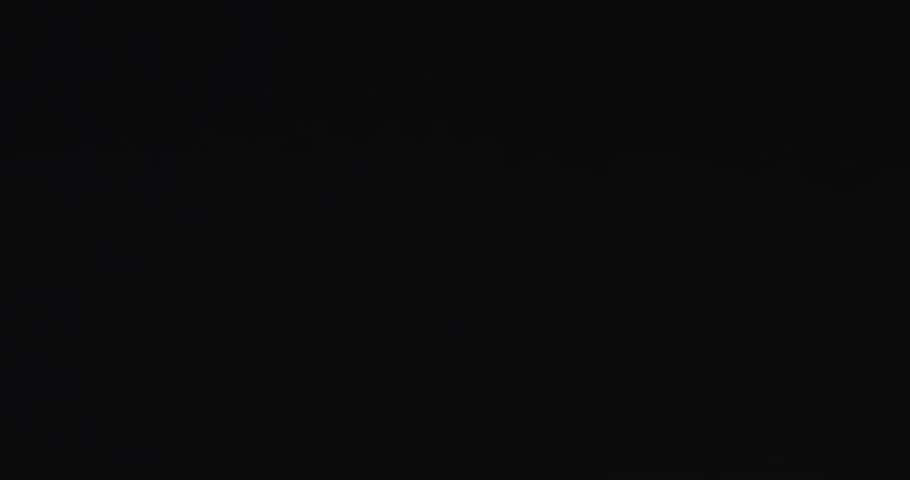 4K VFX practical element slow-motion close-up of dust explosion from bullet hitting the black wall. A dense powder explosion occurs against a black background action element. Gunshot impact on black