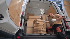 A worker organizes and unloads stacked boxes from the back of a delivery van at a logistics facility. The team is preparing for efficient distribution of goods.  - Powered by Shutterstock - Get 15% off with code: PIKWIZARD15